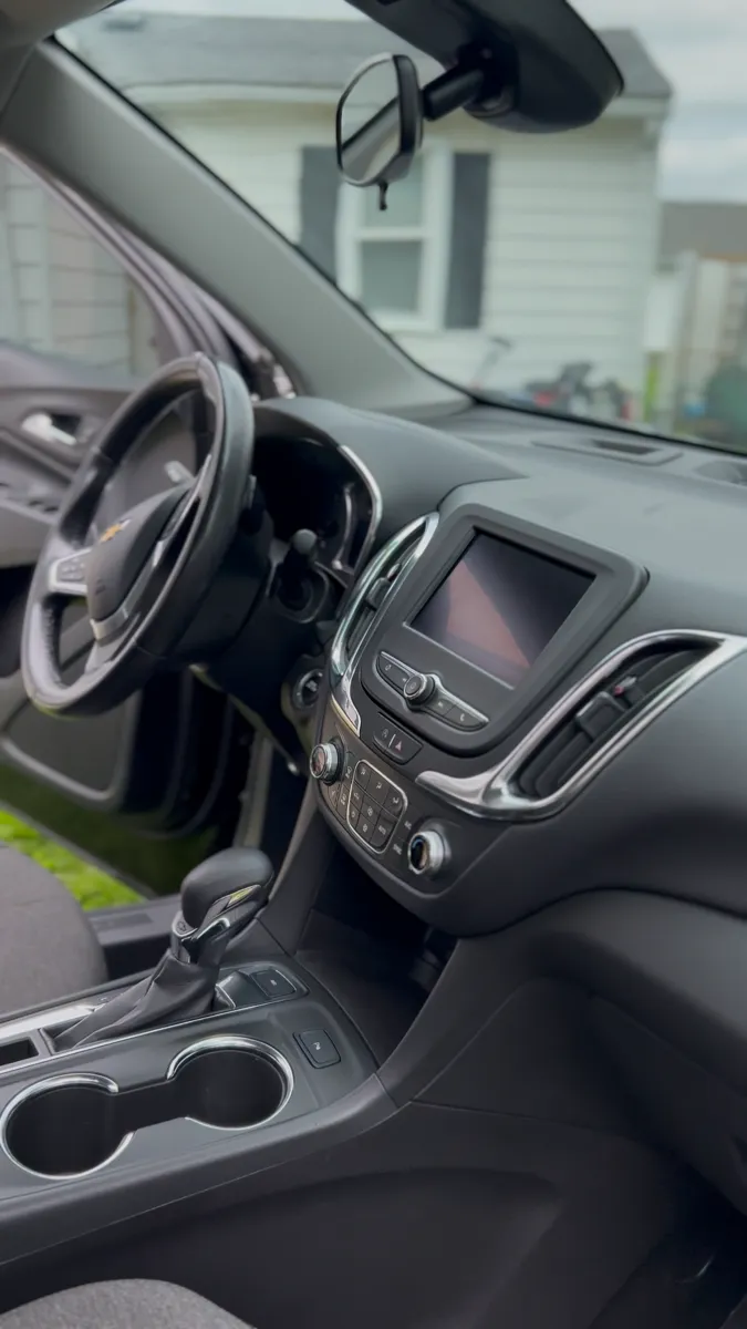 Black cloth front seats after an interior detail