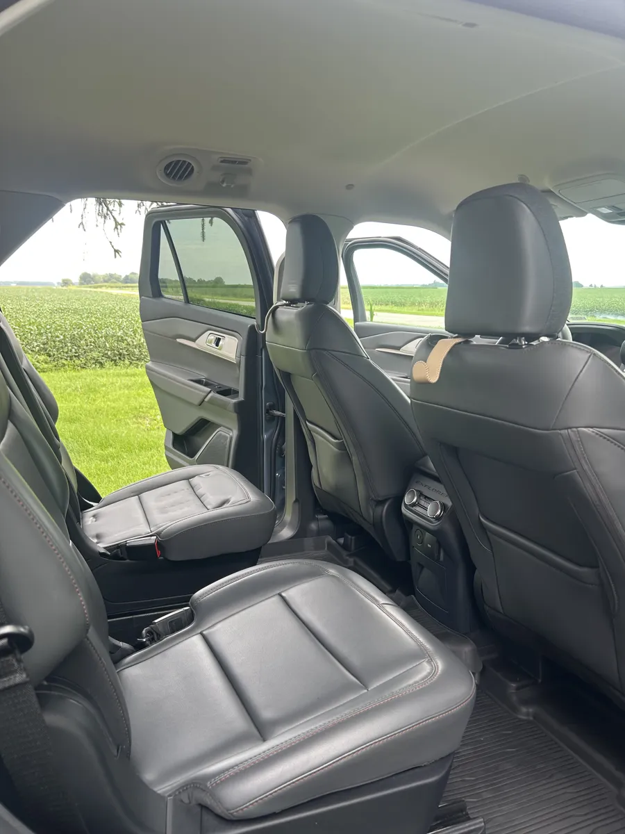 Black leather front seat after an interior detail