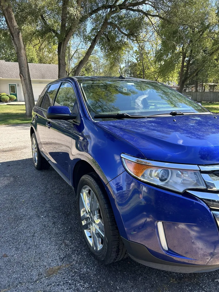 Blue Ford Edge front with fresh shine