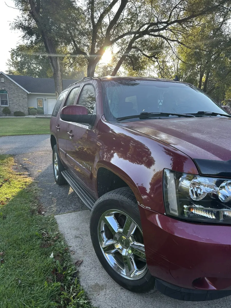 Maroon Chevy Tahoe after an exterior detail