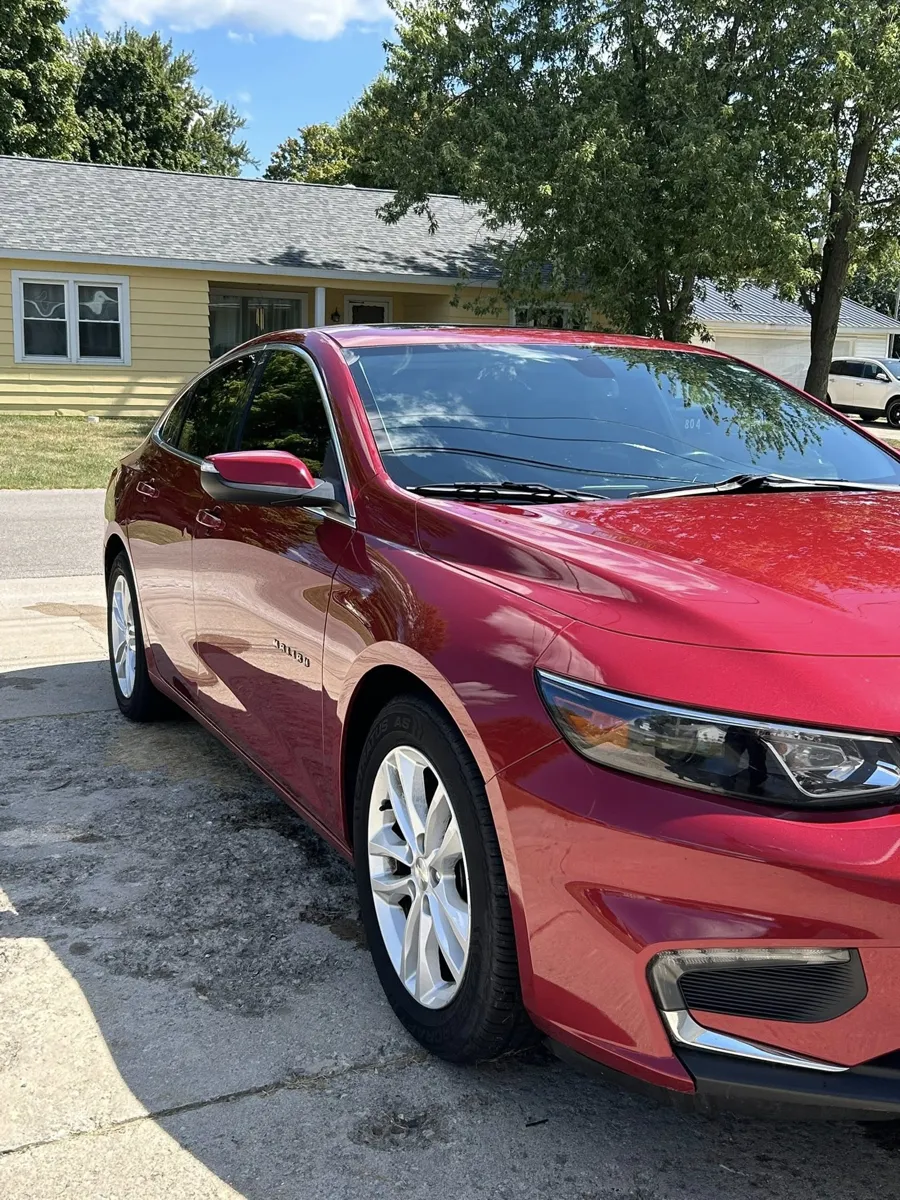 Red Chevy Malibu after an exterior detail