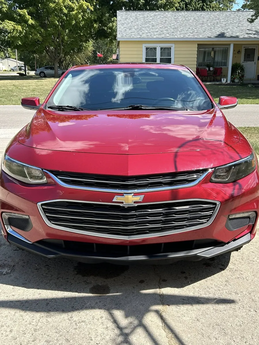 Red Chevy Malibu front end with fresh shine