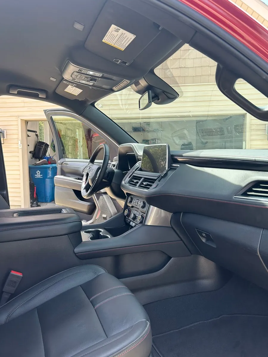 Red Chevy Tahoe dash after detailing