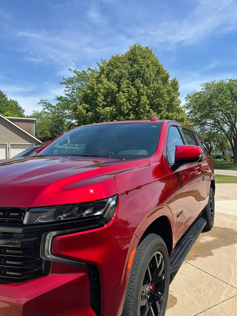Red Chevy Tahoe with a fresh exterior shine