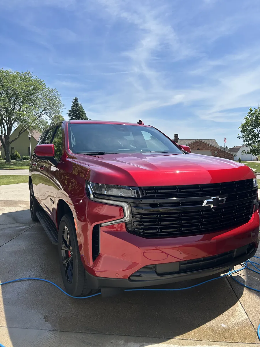Red Chevy Tahoe after a full exterior detail