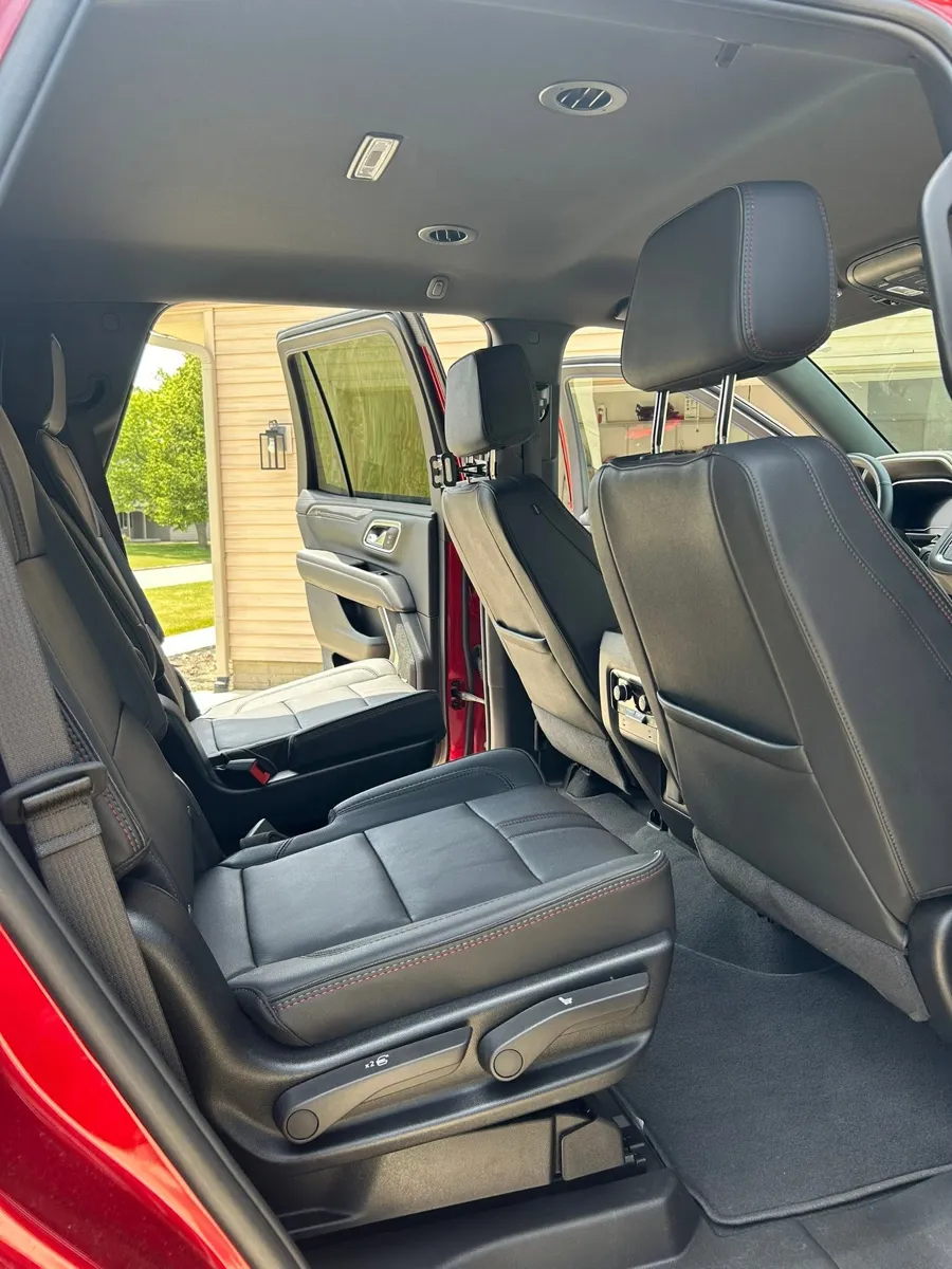 Red Chevy Tahoe rear seats after detailing