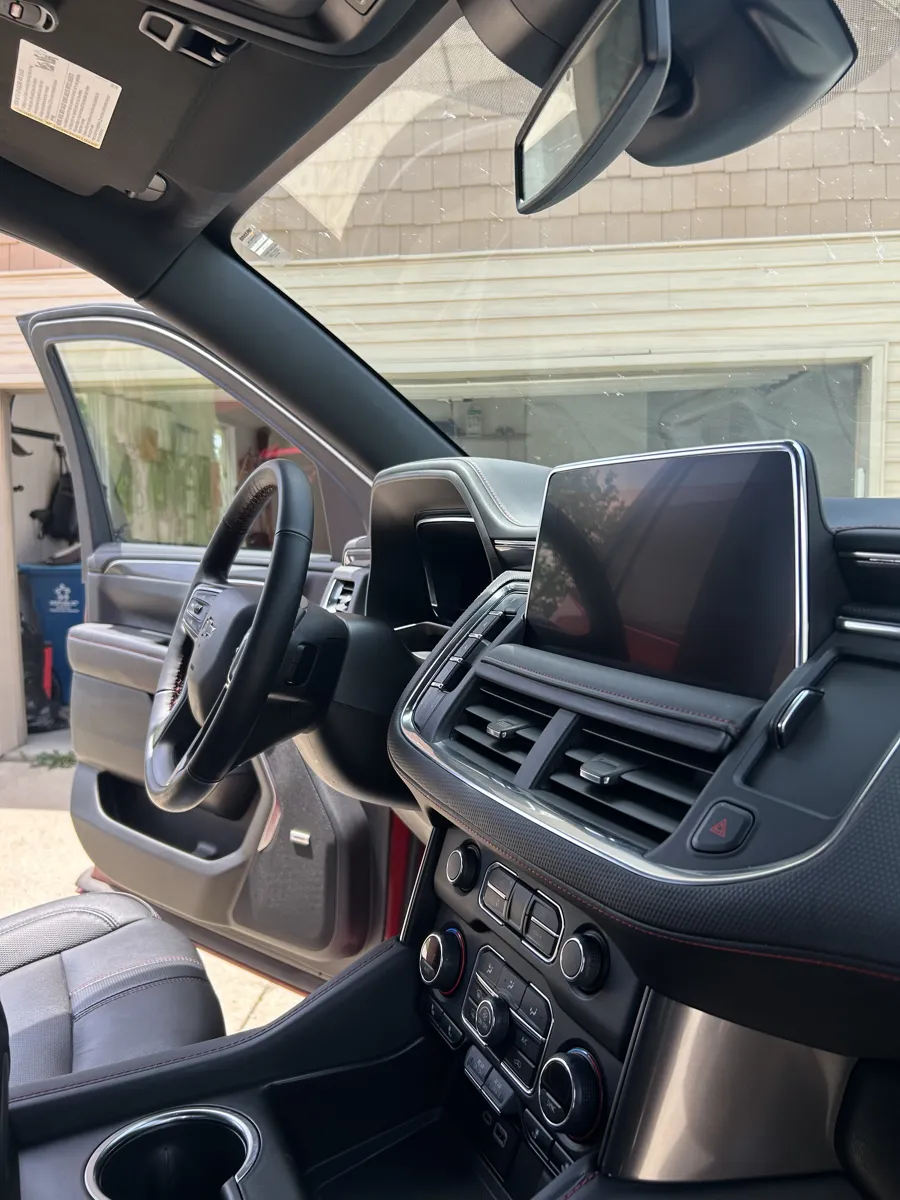 Red SUV dashboard and screen after detailing